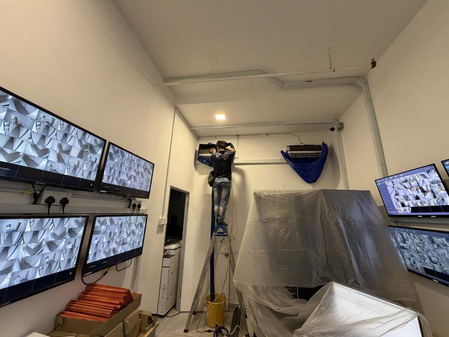 Office aircond canvas wash with equipment covered in plastic sheeting